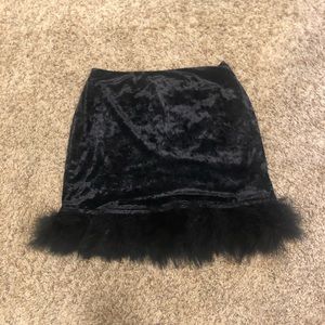 black, feather-lined, velvet miniskirt